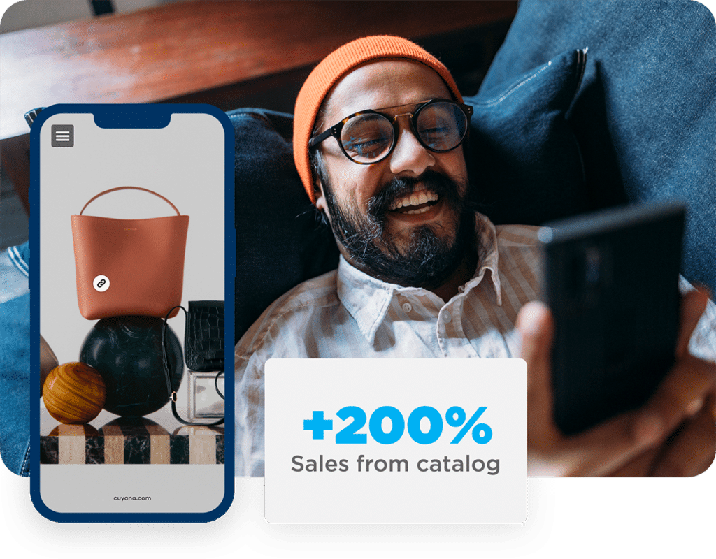 Consultancy 5 Smiling man on a couch browsing a digital catalog. A call-out mentions +200% sales from catalog.