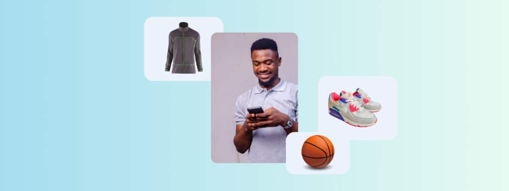 A man on his phone surrounded by a basketball, sneakers and a running top