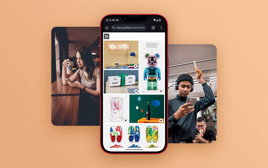 What is a Digital Catalog & How it Can Boost Sales in 2025 1 A red phone on an orange background, showing MoMA's gift guide. On the sides, people browsing the catalog on their phone.